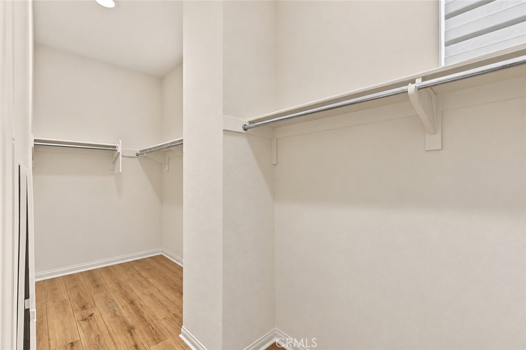 AI-Edited – Clothing Digitally Removed - Primary Bedroom Walk In Closet - 8881 Orangethorpe, Buena Park CA 90621 - photo 26