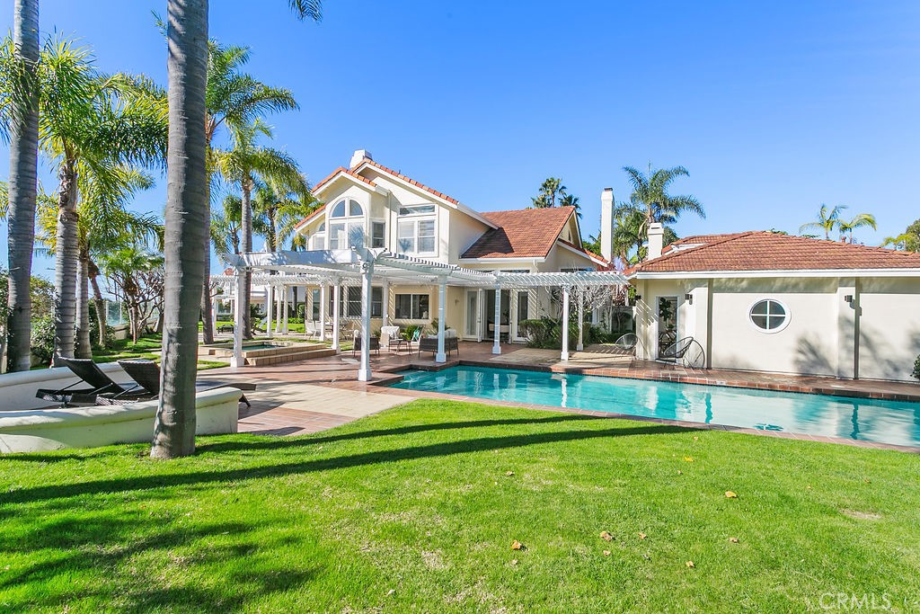 Pool house and main house as seen from one of the 4 yards. - 19 Harbor Pointe, Corona Del Mar CA 92625 - photo 7
