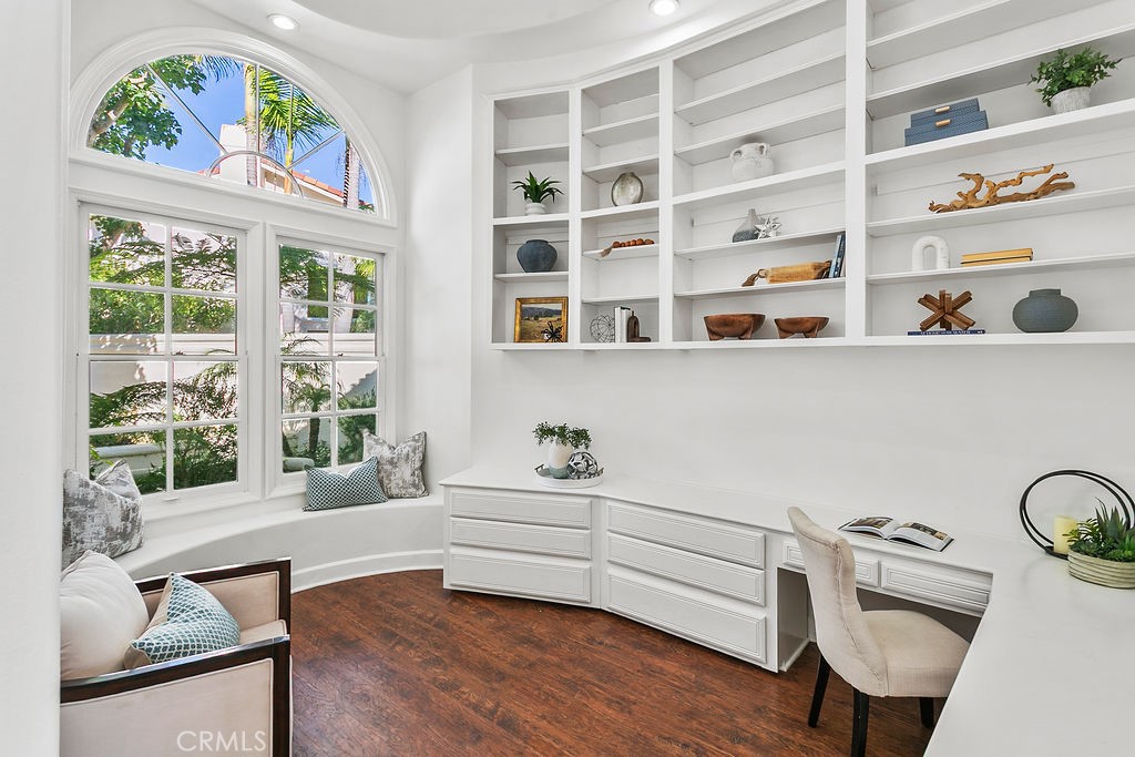 Sun lit windows and tall ceilings help make this downstairs office a comfortable place to work. - 19 Harbor Pointe, Corona Del Mar CA 92625 - photo 15
