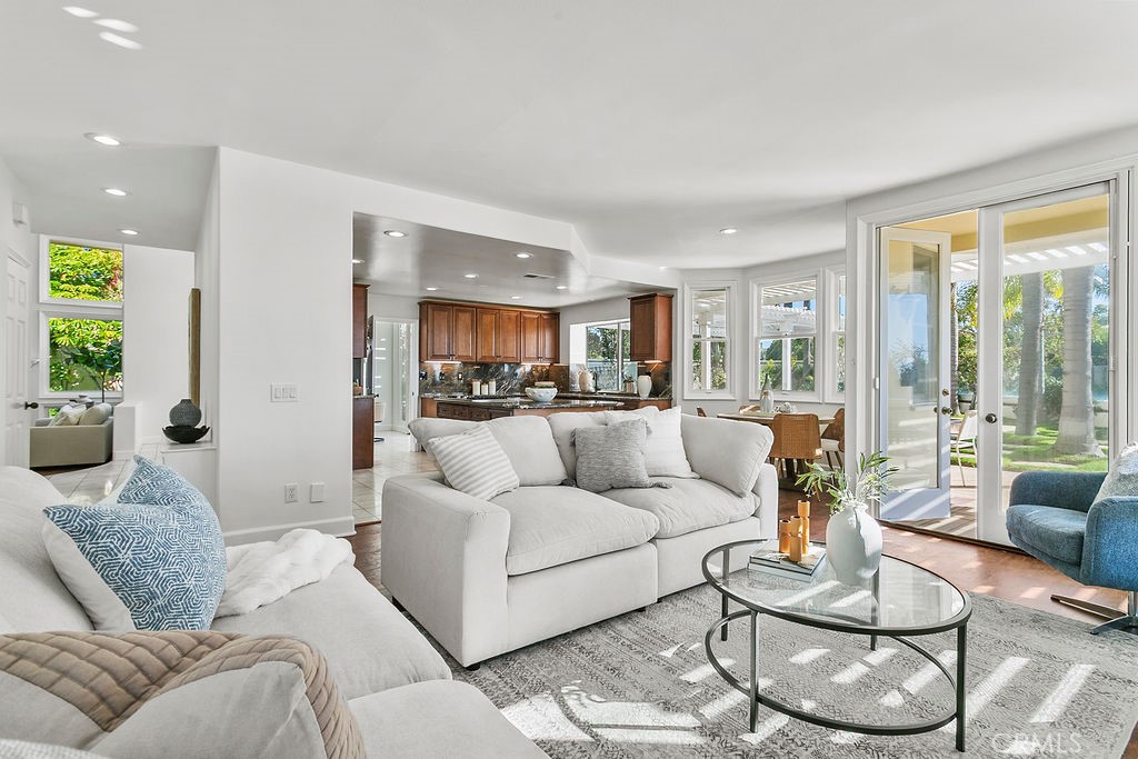 Family room opens to the outdoors as well as the kitchen. - 19 Harbor Pointe, Corona Del Mar CA 92625 - photo 19