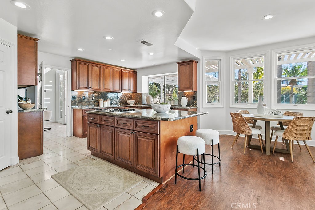 Kitchen with island and breakfast area cove. - 19 Harbor Pointe, Corona Del Mar CA 92625 - photo 20