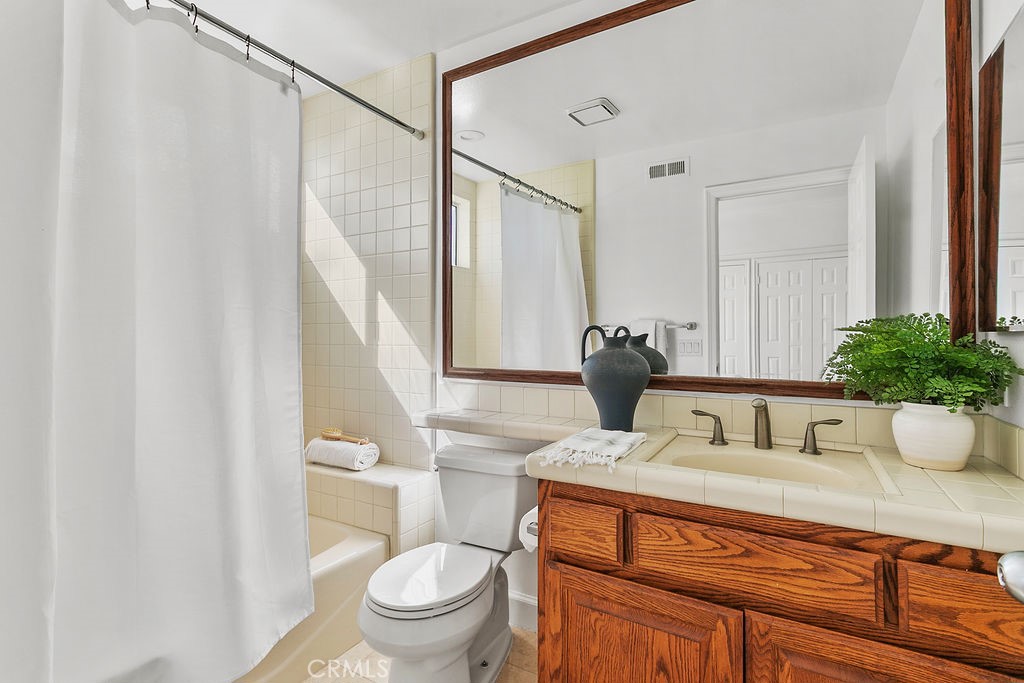 Bath adjacent to the ensuite downstairs bedroom. - 19 Harbor Pointe, Corona Del Mar CA 92625 - photo 27