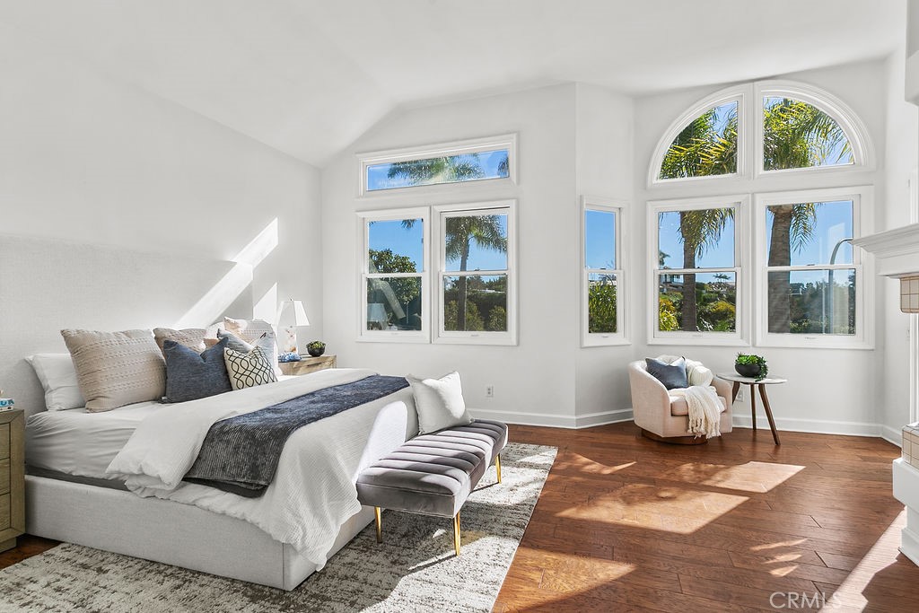 Your primary suite welcomes your view with tall windows and vaulted ceiling. - 19 Harbor Pointe, Corona Del Mar CA 92625 - photo 28