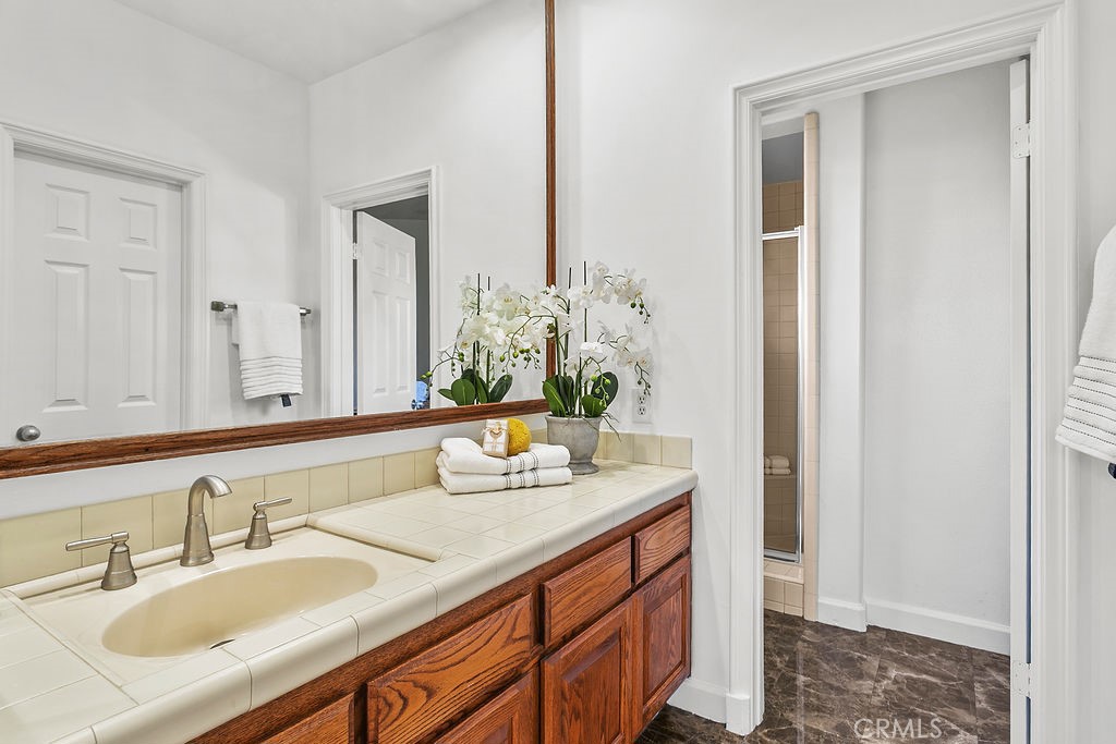 Secondary upstairs bathroom with walkin shower. - 19 Harbor Pointe, Corona Del Mar CA 92625 - photo 36