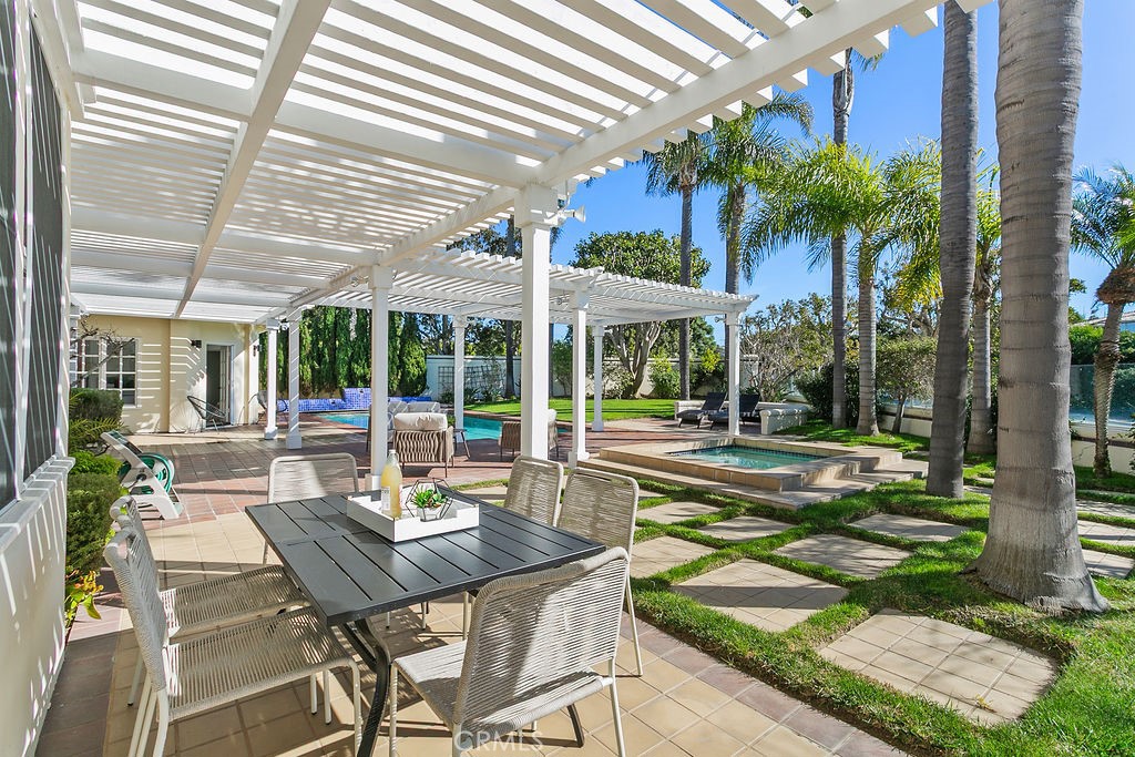 Outside eating area adjacent to the kitchen. - 19 Harbor Pointe, Corona Del Mar CA 92625 - photo 48