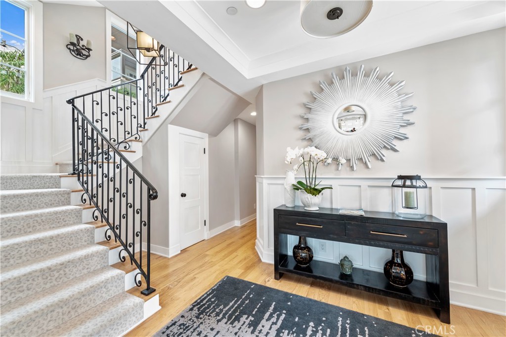 Foyer leads to guest bedrooms, bath, laundry and garage to right. - 212 Marguerite Avenue, Corona Del Mar CA 92625 - photo 6