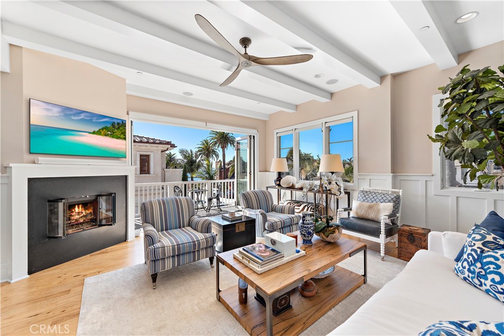 Living room with ocean view, designer furnishings, bifold doors and balcony. - 212 Marguerite Avenue, Corona Del Mar CA 92625 - photo 9