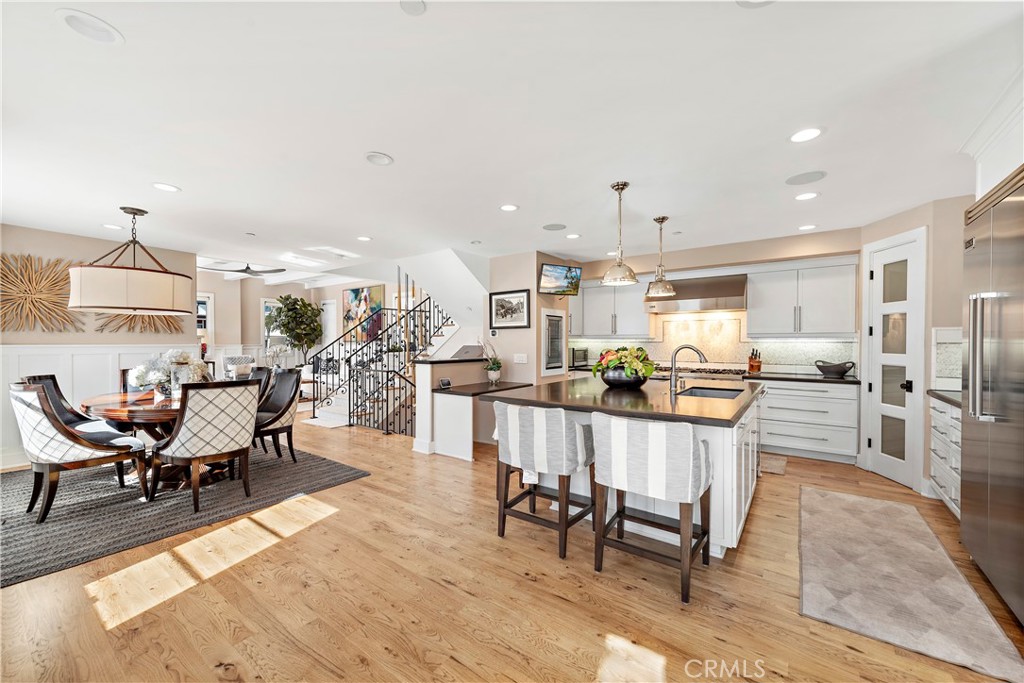 Open concept gourmet kitchen and dining area. - 212 Marguerite Avenue, Corona Del Mar CA 92625 - photo 11