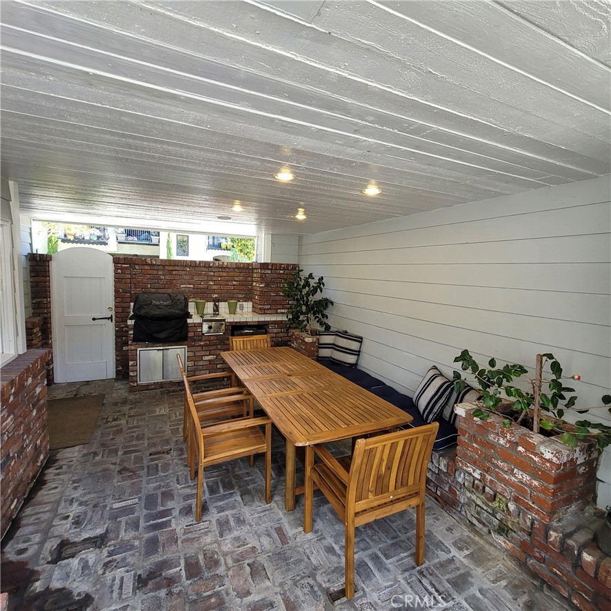Downstairs patio with ample seating and barbeque - 232 Jasmine, Corona Del Mar CA 92625 - photo 11