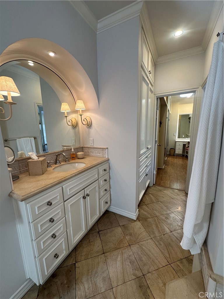Primary bathroom includes two separate vanities and soaking tub. - 232 Jasmine, Corona Del Mar CA 92625 - photo 17