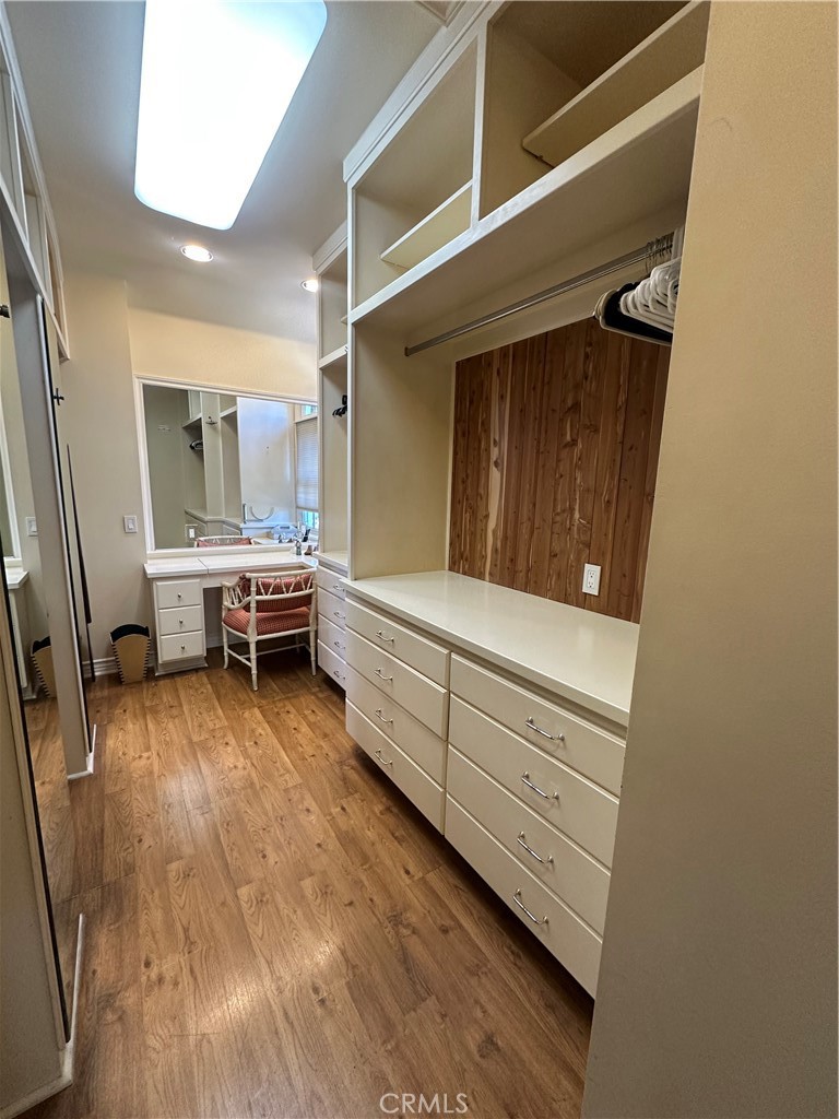 Huge walk in closet with built in drawers, vanity - 232 Jasmine, Corona Del Mar CA 92625 - photo 18