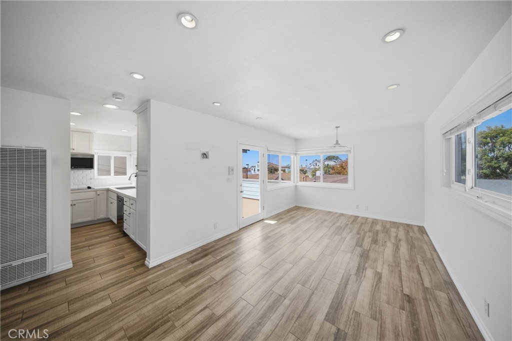 Spacious great room opens directly to updated kitchen. - 412 1/2 Dahlia Avenue, Corona Del Mar CA 92625 - photo 10