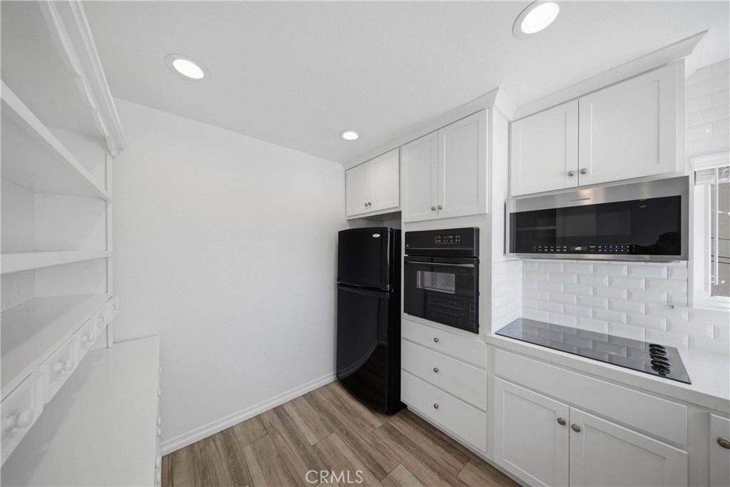Additional charming shelving to accommodate for kitchen and pantry. - 412 1/2 Dahlia Avenue, Corona Del Mar CA 92625 - photo 13