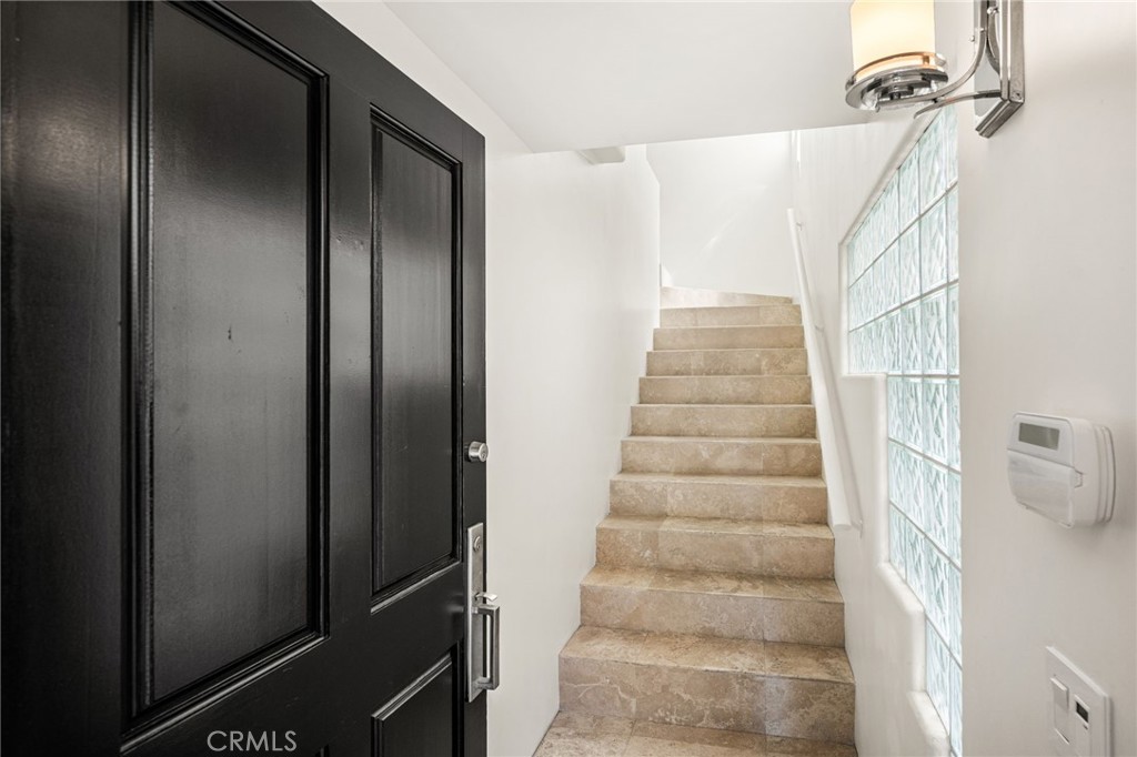enhanced with travertine flooring - 506 1/2 Acacia, Corona Del Mar CA 92625 - photo 5