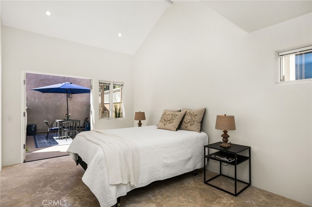 a main-level primary bedroom, opens to the patio - 506 1/2 Acacia, Corona Del Mar CA 92625 - photo 20