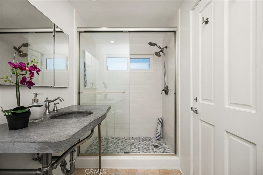 hand-picked upgrades include a natural stone vanity, and ocean-themed hex-tile - 506 1/2 Acacia, Corona Del Mar CA 92625 - photo 32