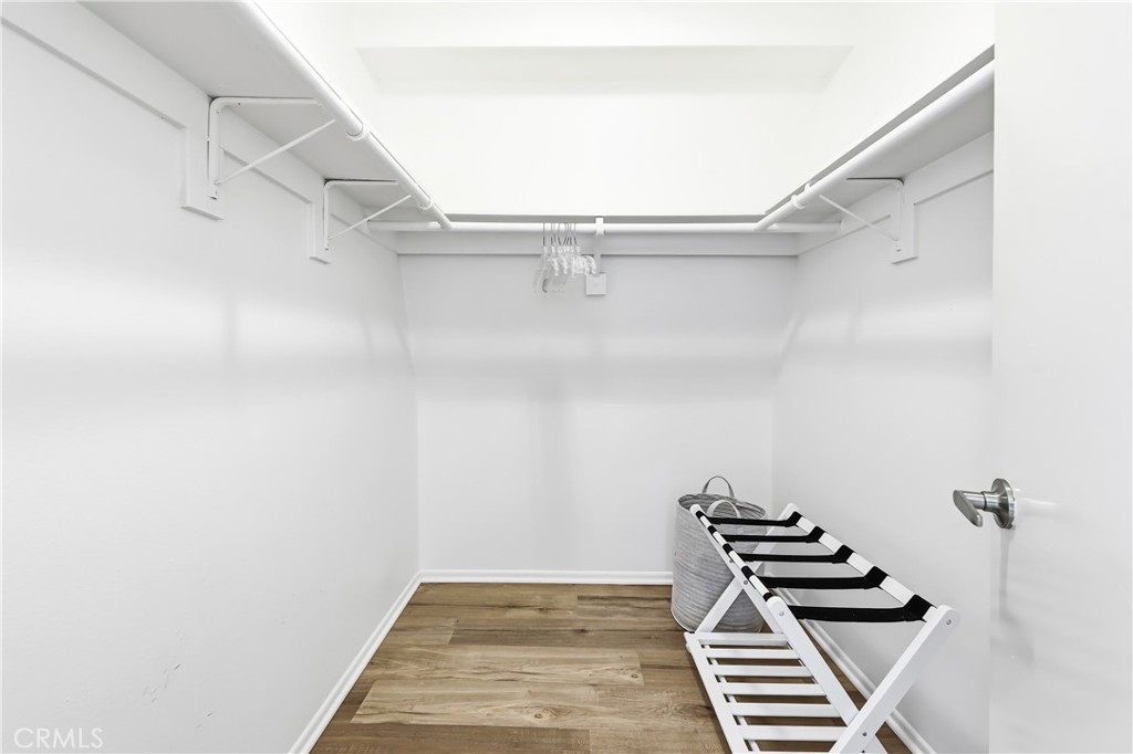 This is the spacious walk-in closet in the primary suite. - 602 602.5 Marguerite 2, Corona Del Mar CA 92625 - photo 15