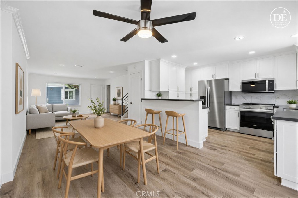 Living, dining and kitchen! Virtual staging shown. - 116 Brookline, Costa Mesa CA 92626 - photo 1