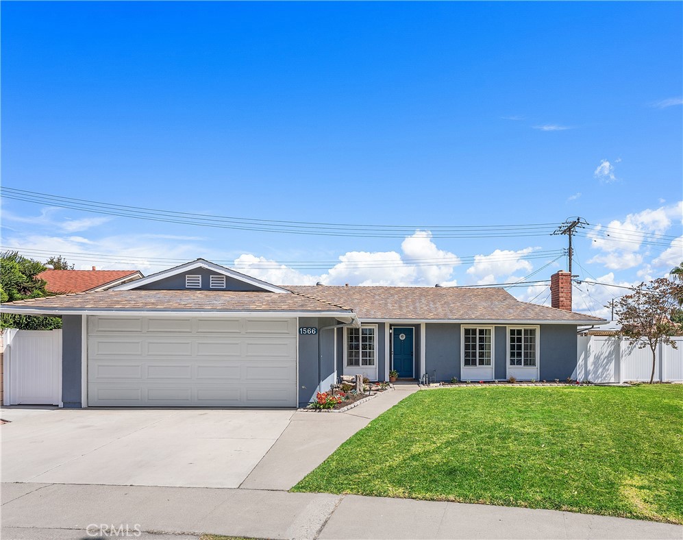Single-story ranch home with fresh gray exterior, blue front door, large windows, and excellent curb appeal. - 1566 Corsica Place, Costa Mesa CA 92626 - photo 1