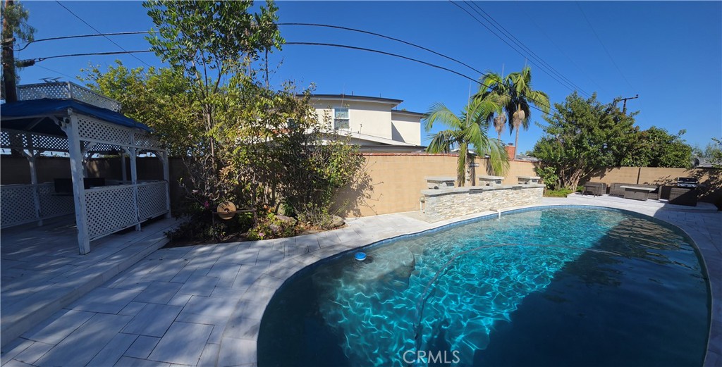 Backyard pool with Gazebo and sitting area with fireplace and bbq. - 1628 White Oak, Costa Mesa CA 92626 - photo 7