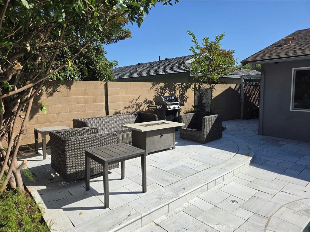 Backyard Sitting Area adjacent to pool. - 1628 White Oak, Costa Mesa CA 92626 - photo 8