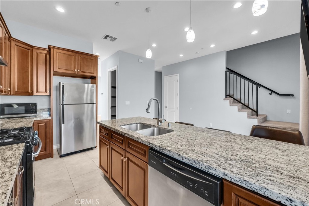Kitchen with stainless steel appliances - 1810 Pomona, Costa Mesa CA 92627 - photo 14