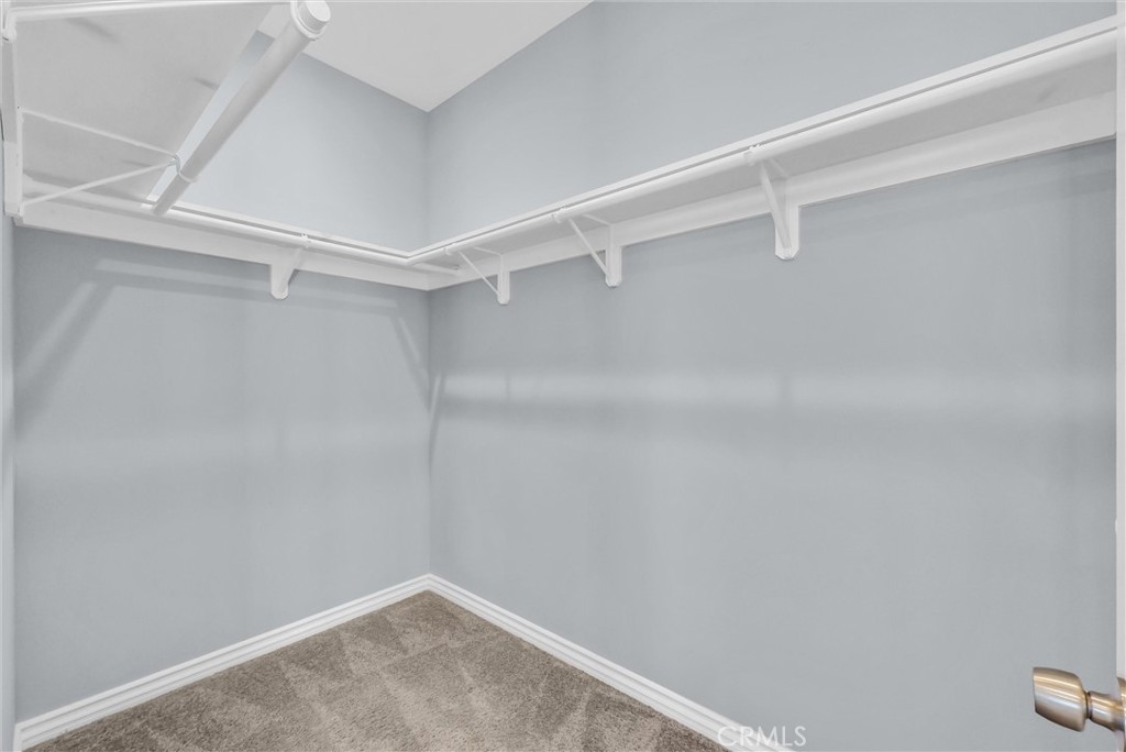 Primary Suite's walk-in closet - 1810 Pomona, Costa Mesa CA 92627 - photo 21