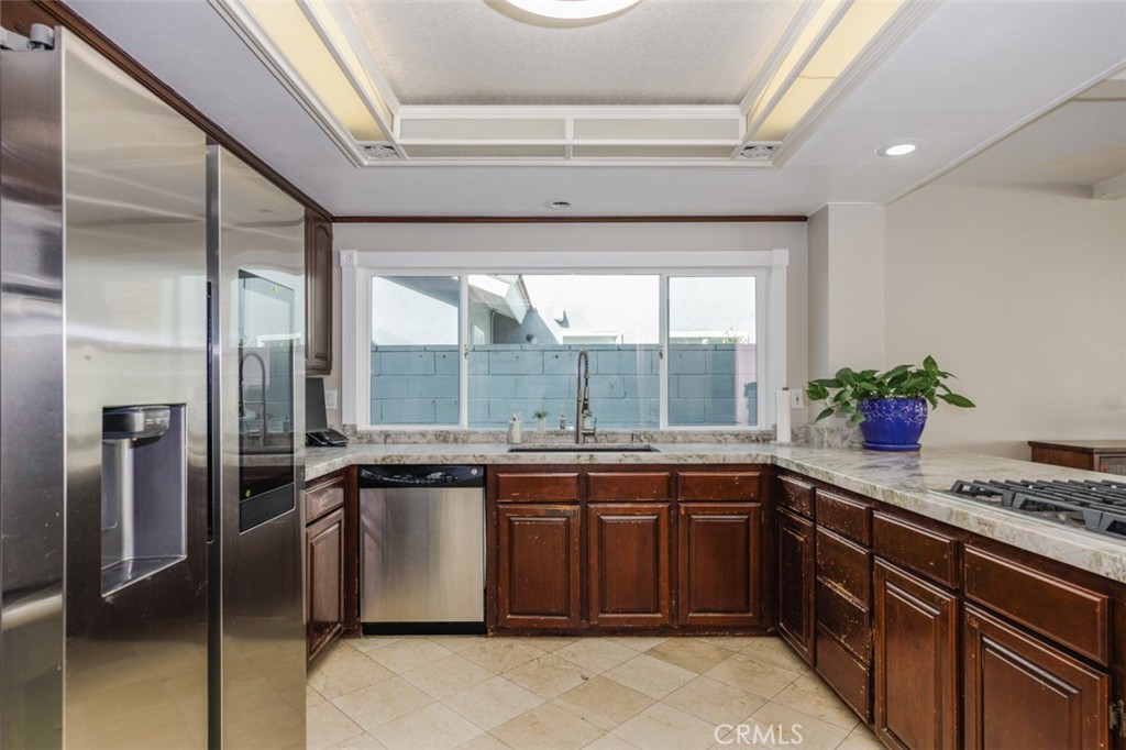 bright kitchen, cooks dream, stainless steel appliances - 1828 Kinglet Court, Costa Mesa CA 92626 - photo 15