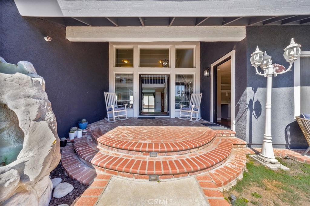 enjoy serene front porch, double door entry - 1828 Kinglet Court, Costa Mesa CA 92626 - photo 19