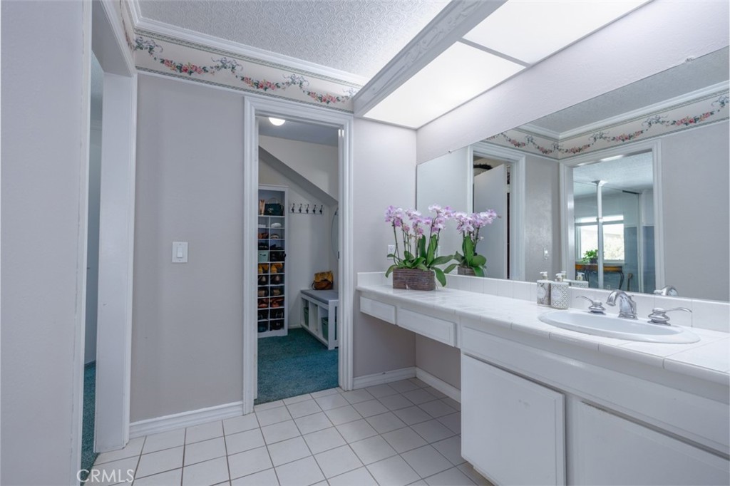 master bath vanity to wlk in closet - 1828 Kinglet Court, Costa Mesa CA 92626 - photo 22