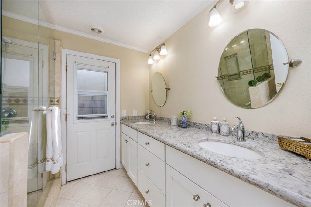 1st floor bath double vanity, clear glass shower - 1828 Kinglet Court, Costa Mesa CA 92626 - photo 36