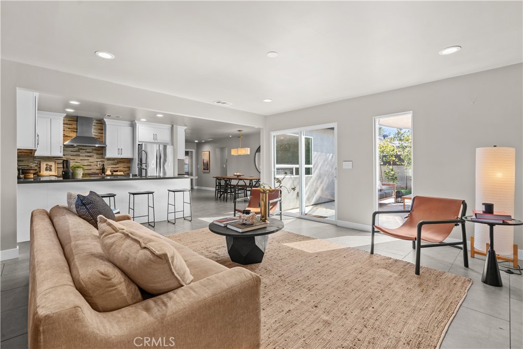 Living room looking towards kitchen and dining. - 2103 Continental, Costa Mesa CA 92627 - photo 7