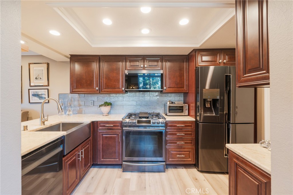 Remodeled Kitchen with quartzite counters - 2168 San Michel E B, Costa Mesa CA 92627 - photo 10