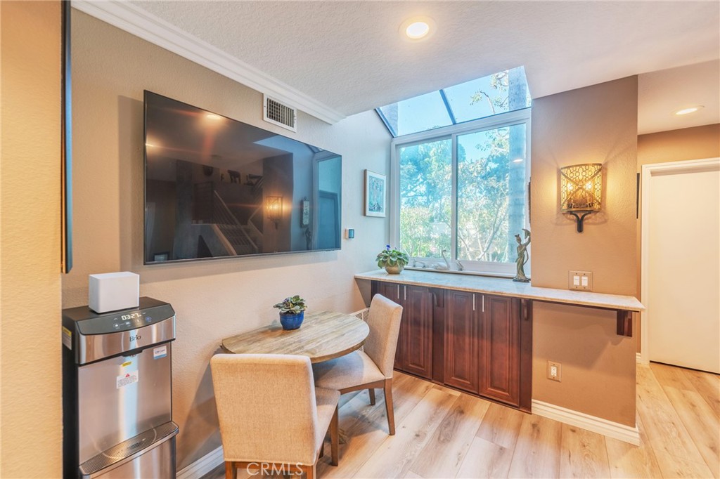 Built in bar area overlooking your beautiful yard and a ton of natural light! - 2168 San Michel E B, Costa Mesa CA 92627 - photo 13