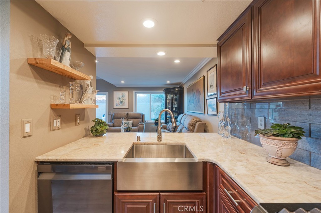Beautiful cabinets kitchen opens up to living room - 2168 San Michel E B, Costa Mesa CA 92627 - photo 16