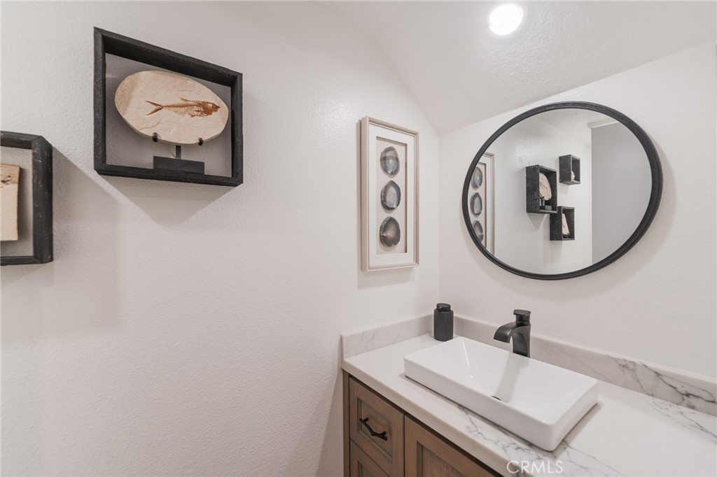Downstairs bathroom with custom made cabinet - 2168 San Michel E B, Costa Mesa CA 92627 - photo 18