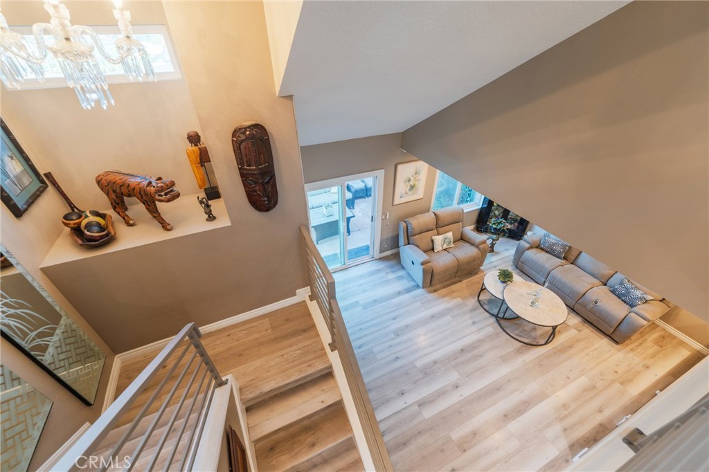 Top of the landing looking down into your living area - 2168 San Michel E B, Costa Mesa CA 92627 - photo 20
