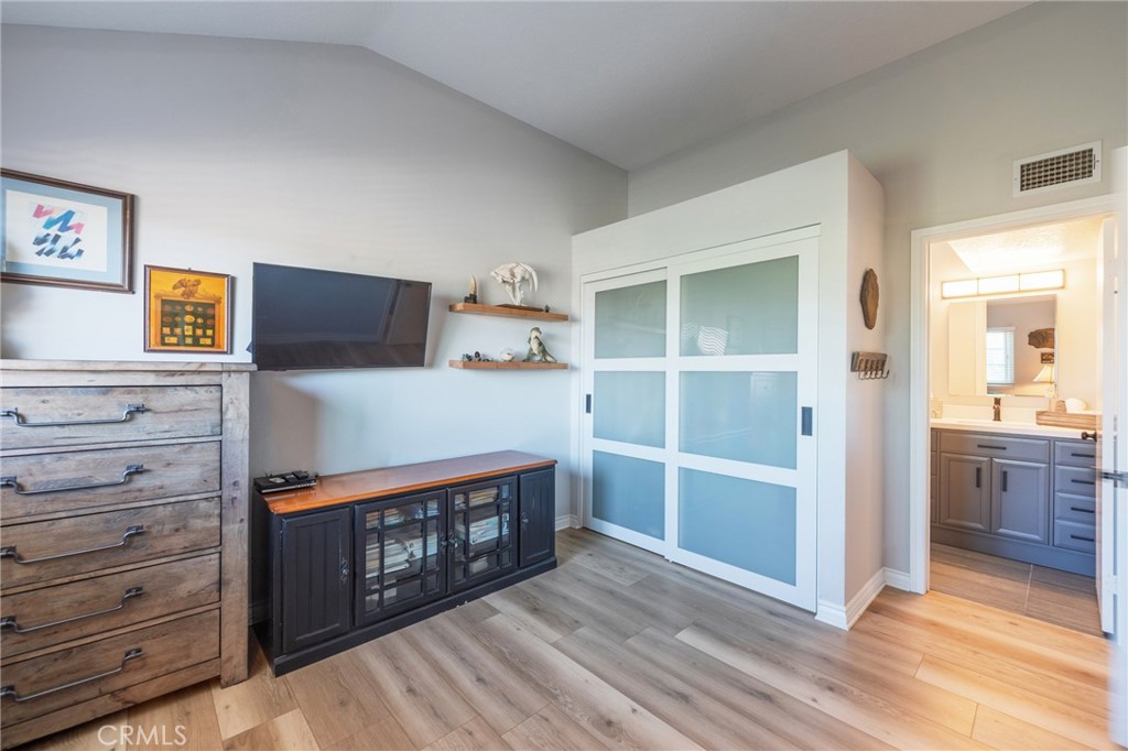 Another angle of 2nd bedroom with attached full bathroom and newer closet doors - 2168 San Michel E B, Costa Mesa CA 92627 - photo 28