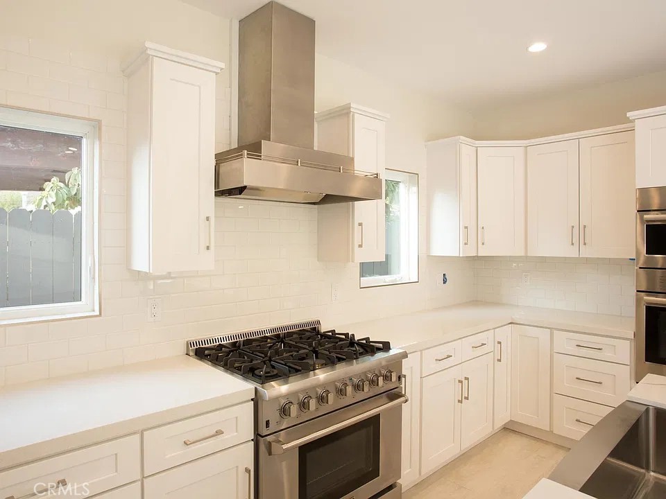 6 burner stove with soft close cabinets and drawers - 241 E 19th Street, Costa Mesa CA 92627 - photo 9