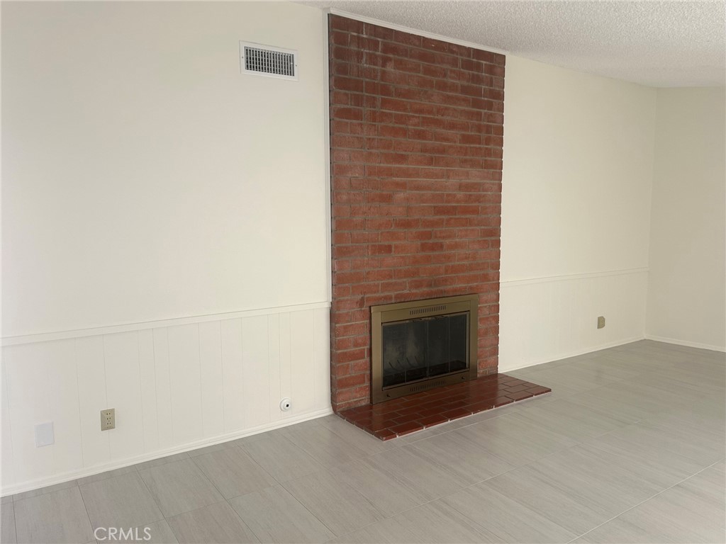 Living Room Fireplace - 248 Wake Forest, Costa Mesa CA 92626 - photo 2