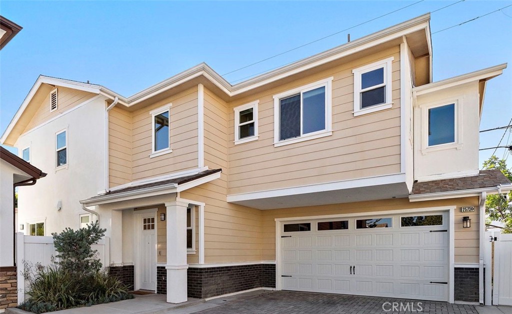 Located in the best spot of this enclave - the rear house furthest from the street and forward facing. 2-car garage + 2- - 2573 Elden Avenue D, Costa Mesa CA 92627 - photo 1