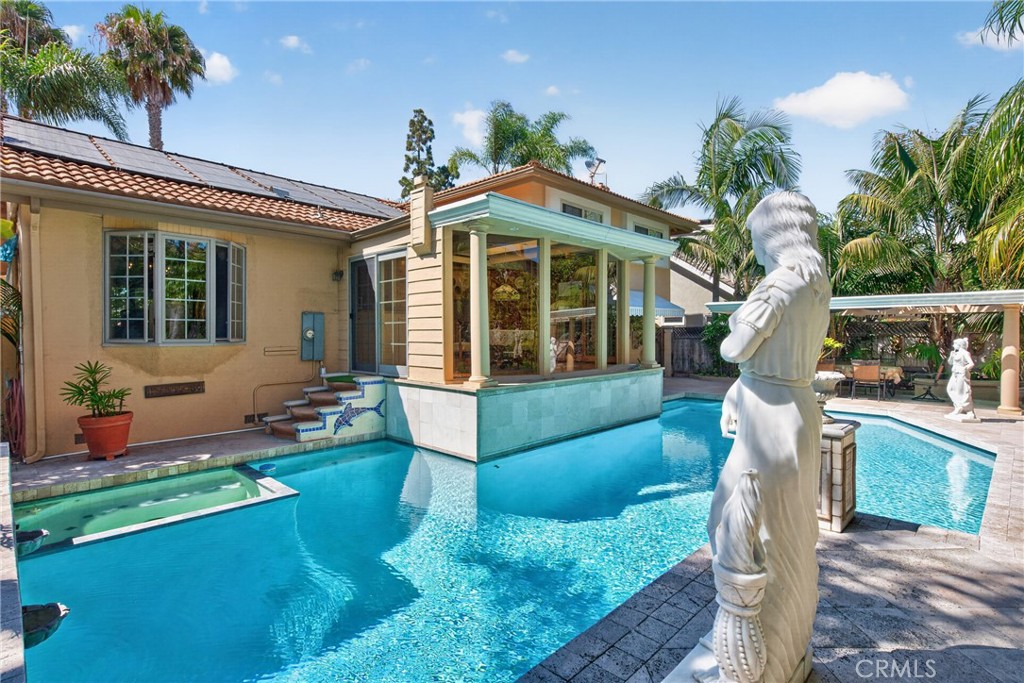Oversized pool that resembles the Neptune Pool at San Simeon's Hearst Casltle, roomy spa and 3 decorative waterfalls in - 2740 Cardinal Drive, Costa Mesa CA 92626 - photo 5