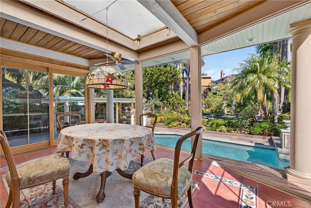 Expanded sunroom/breakfast area overlooking oversized pool & and huge back yard garden organic sanctuary/refuge filled e - 2740 Cardinal Drive, Costa Mesa CA 92626 - photo 24