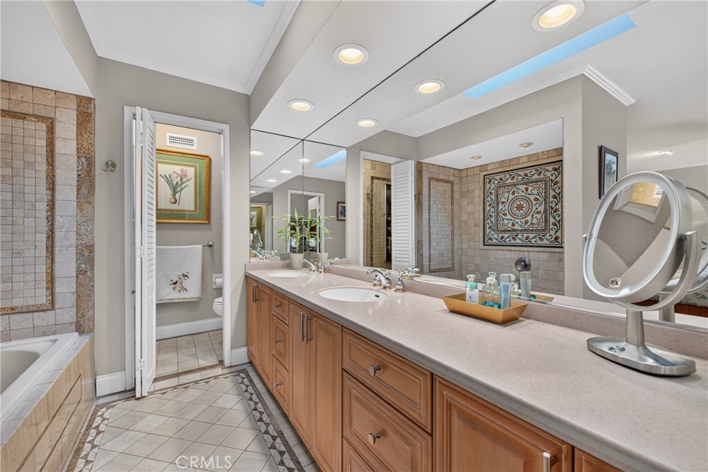 Master suite has walk in closet, spa tub and separate mosaic tiled shower with massage water features. - 2740 Cardinal Drive, Costa Mesa CA 92626 - photo 34