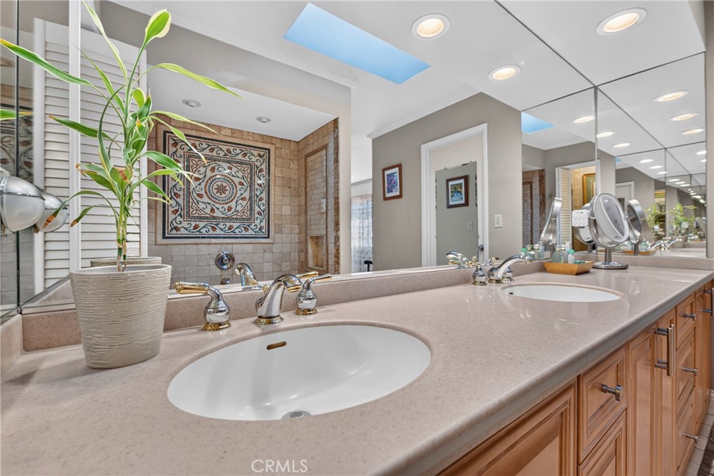 Master suite has walk in closet, spa tub and separate mosaic tiled shower with massage water features. - 2740 Cardinal Drive, Costa Mesa CA 92626 - photo 35