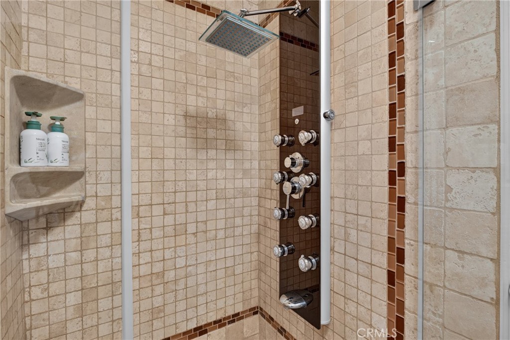 Master suite has walk in closet, spa tub and separate mosaic tiled shower with massage water features. - 2740 Cardinal Drive, Costa Mesa CA 92626 - photo 36