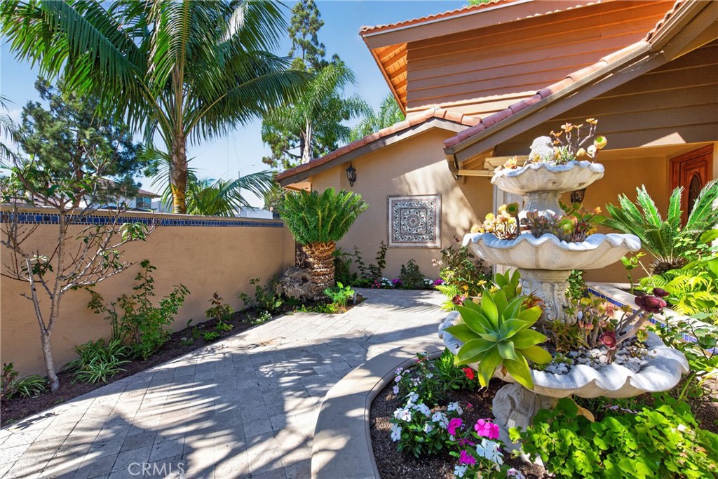 Gorgeous Courtyard entry with 3 level fountain and vibrant plants and flowers throughout. - 2740 Cardinal Drive, Costa Mesa CA 92626 - photo 48