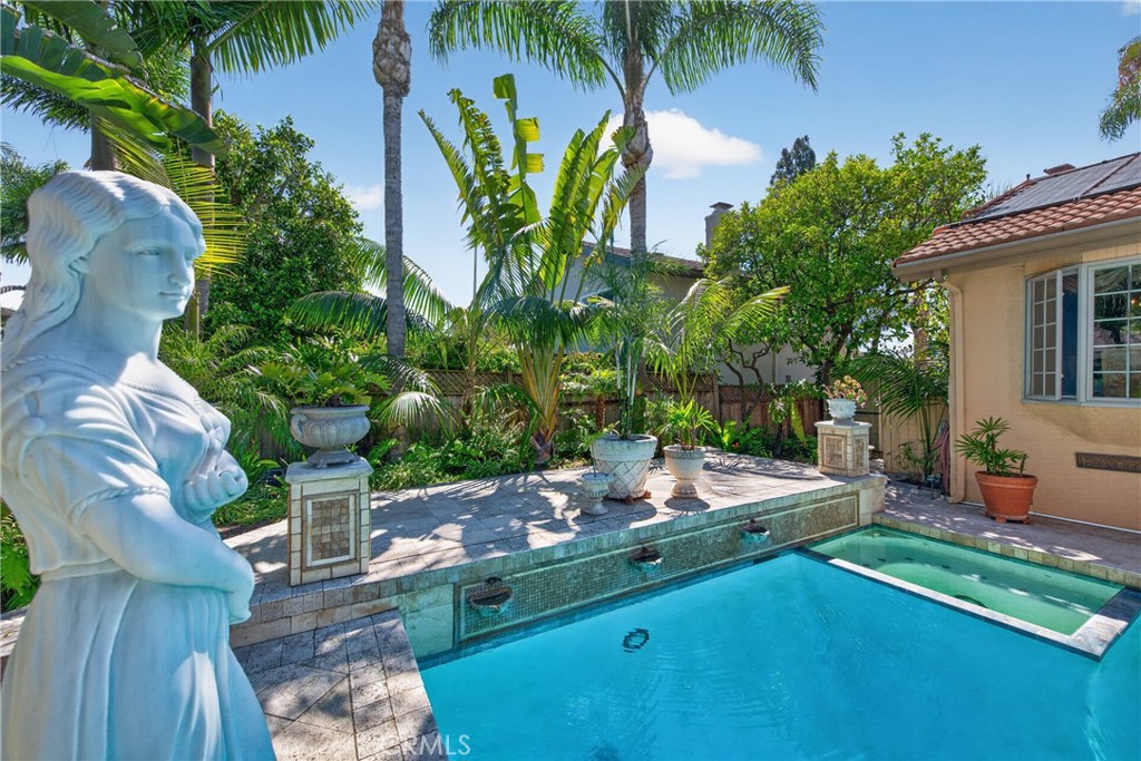 Oversized pool that resembles the Neptune Pool at San Simeon's Hearst Casltle, roomy spa and 3 decorative waterfalls in - 2740 Cardinal Drive, Costa Mesa CA 92626 - photo 62