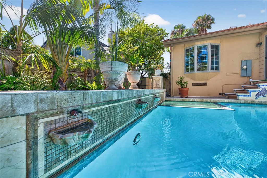 Oversized pool that resembles the Neptune Pool at San Simeon's Hearst Casltle, roomy spa and 3 decorative waterfalls in - 2740 Cardinal Drive, Costa Mesa CA 92626 - photo 70