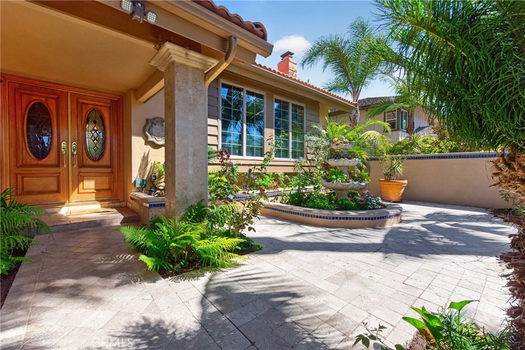 Gorgeous Courtyard entry with 3 level fountain and vibrant plants and flowers throughout. - 2740 Cardinal Drive, Costa Mesa CA 92626 - photo 71
